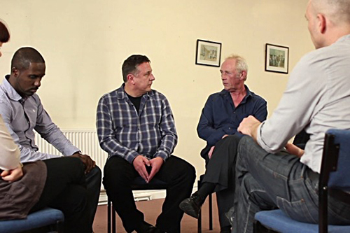group of men talking