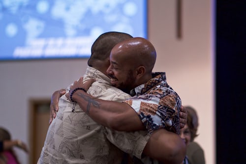 men hugging